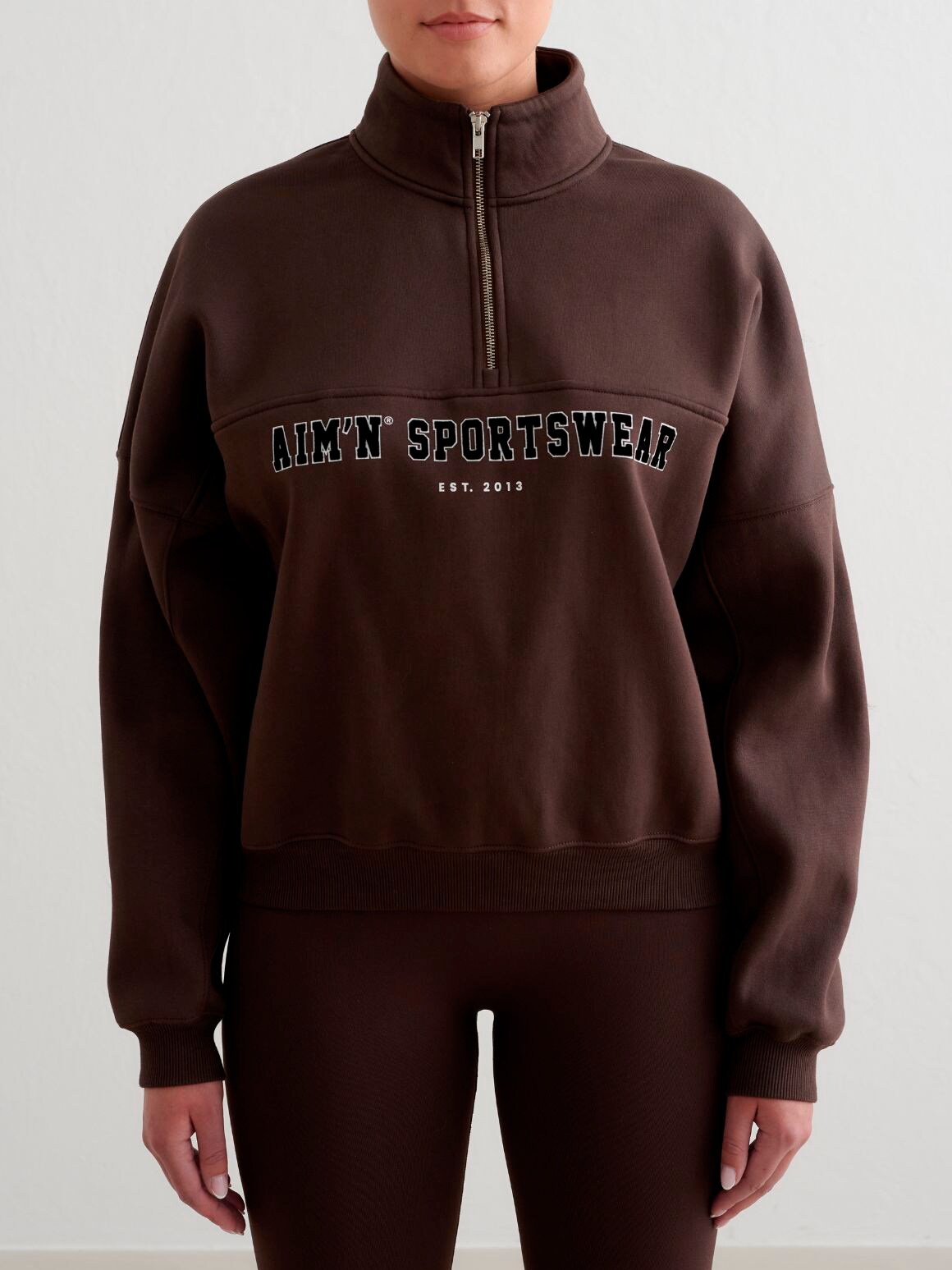 
AIM&acute;N, 
W Varisty Sweat Half Zip, 
Detail 1
